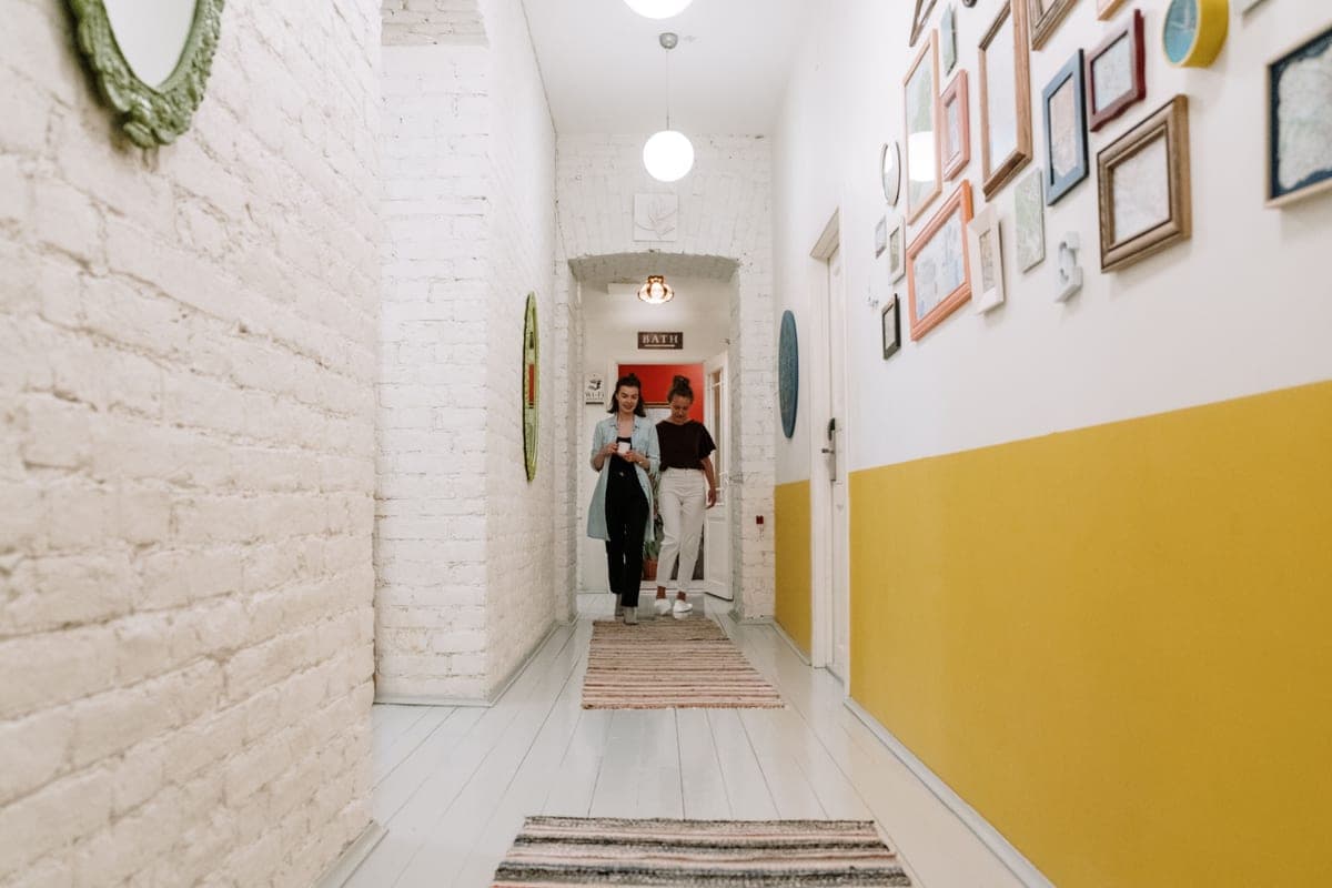 A long runner mat laid inside an entryway hall