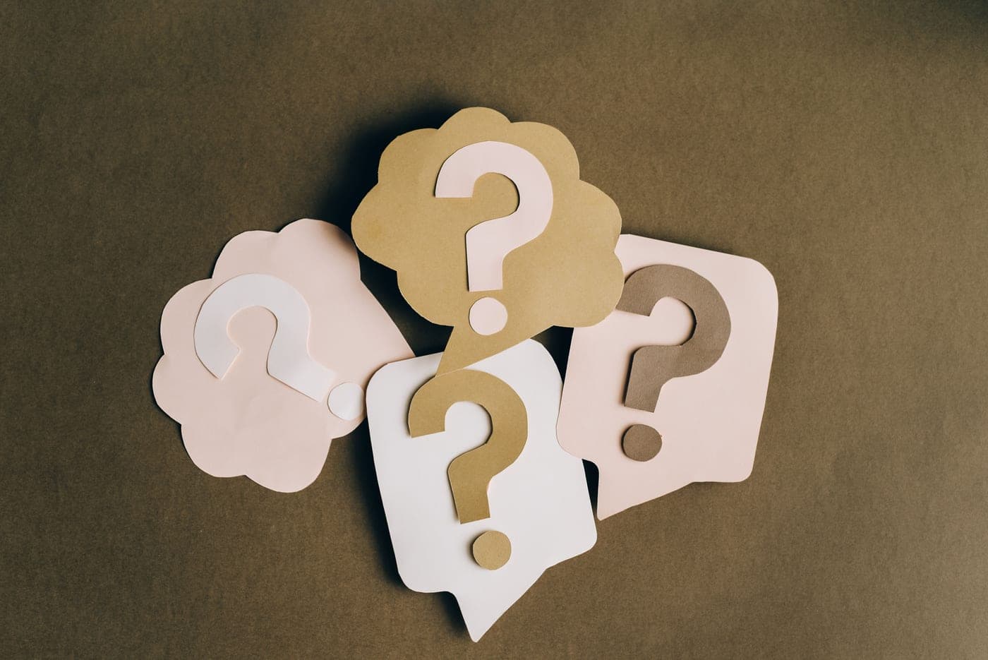 Question marks written on paper